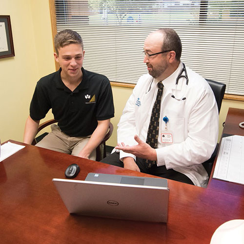 Scott Perkins ’20 collaborated with Dr. Paul Nielsen ’95 (pictured) and Dr. Amy Jolliff, co-medical directors of the ɫƵCommunity Care Network, and Alex Davis, director, to evaluate the outcomes of the Health Coach program.