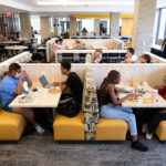 Students eat and socialize in the newly renovated dining area of the Lowry Center at ɫƵ.