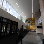 A student in the atrium of the newly-renovated Lowry Center at ɫƵ.